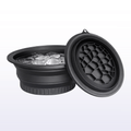 Black honeycomb cooler with ice on a white background
